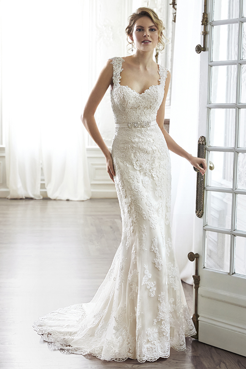 The pinnacle of romance is found in this streamlined sheath rendered in exquisite lace. Complete with dramatic V-back beautifully detailed with illusion lace, sweetheart neckline and delicate cap-sleeves. Finished with covered button over zipper and inner elastic closure and optional grosgrain ribbon belt with beaded motif. Detachable belt sold separately.
<a href="http://www.maggiesottero.com/dress.aspx?style=5MN083&page=0&pageSize=36&keywordText=&keywordType=All" target="_blank">Maggie Sottero</a>