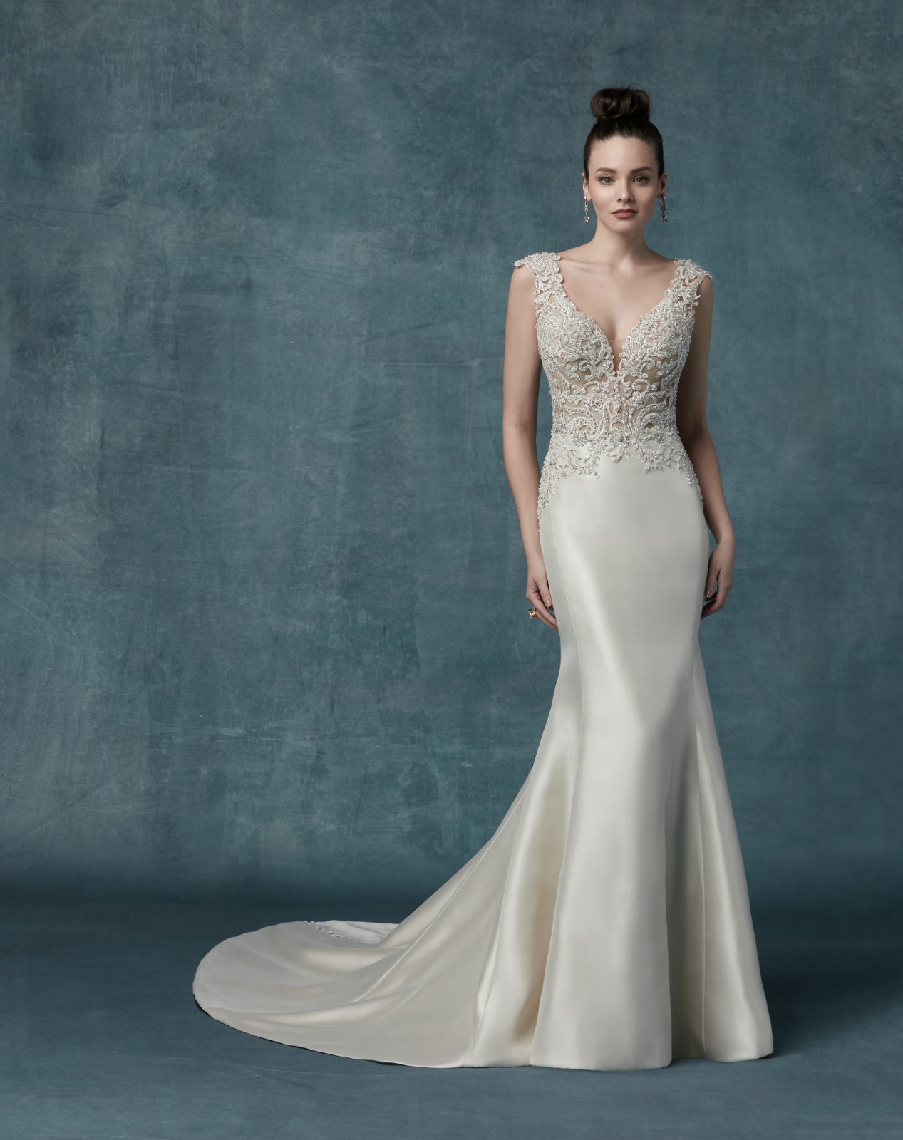 <a href="https://www.maggiesottero.com/maggie-sottero/janelle/11793">Janelle</a> Credits: Maggie Sottero.