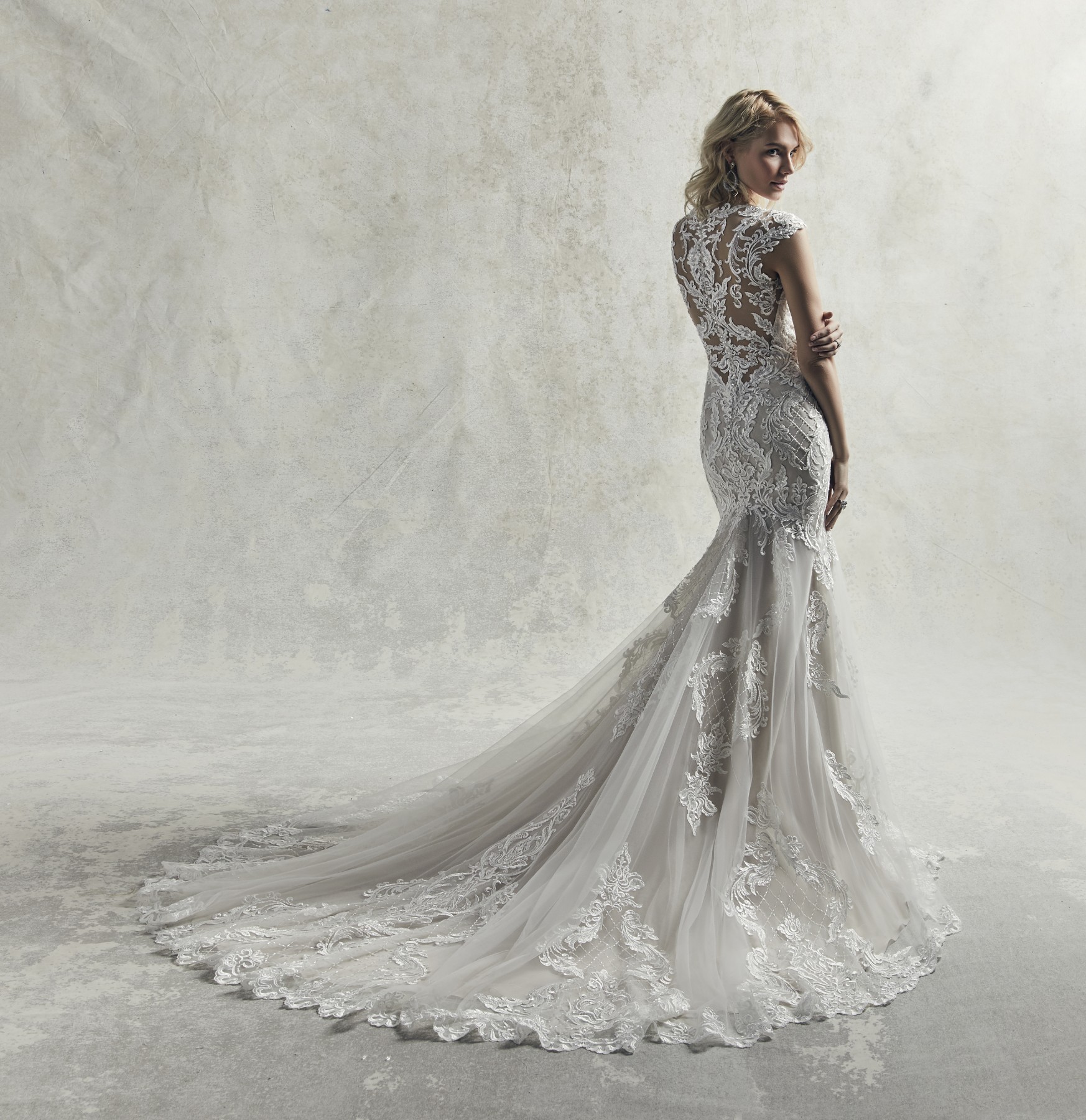 <a href="https://www.maggiesottero.com/sottero-and-midgley/irving/11851">Irving</a> Credits: Sottero &amp; Midgley.