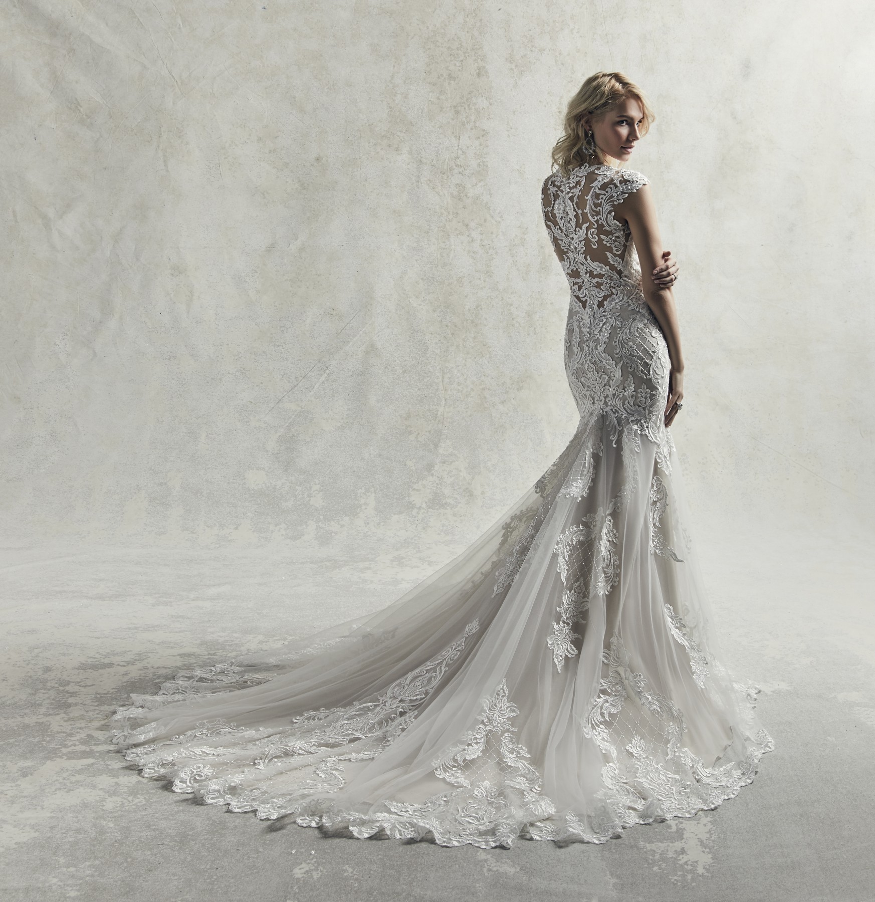 <a href="https://www.maggiesottero.com/sottero-and-midgley/irving/11851">Irving</a> Credits: Sottero & Midgley.