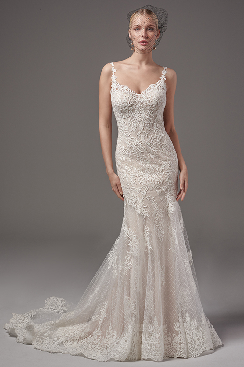 Os pormenores em renda dançam fluidamente ao longo de um tule que apresenta um padrão cruzado neste chic fit-and-flare. Decote em forma de coração e alças em renda. Terminado com botões de cristal em vez de um fecho.
<a href="https://www.maggiesottero.com/sottero-and-midgley/melrose-leigh/10240?utm_source=mywedding.com&utm_campaign=spring17&utm_medium=gallery" target="_blank">Sottero and Midgley</a>