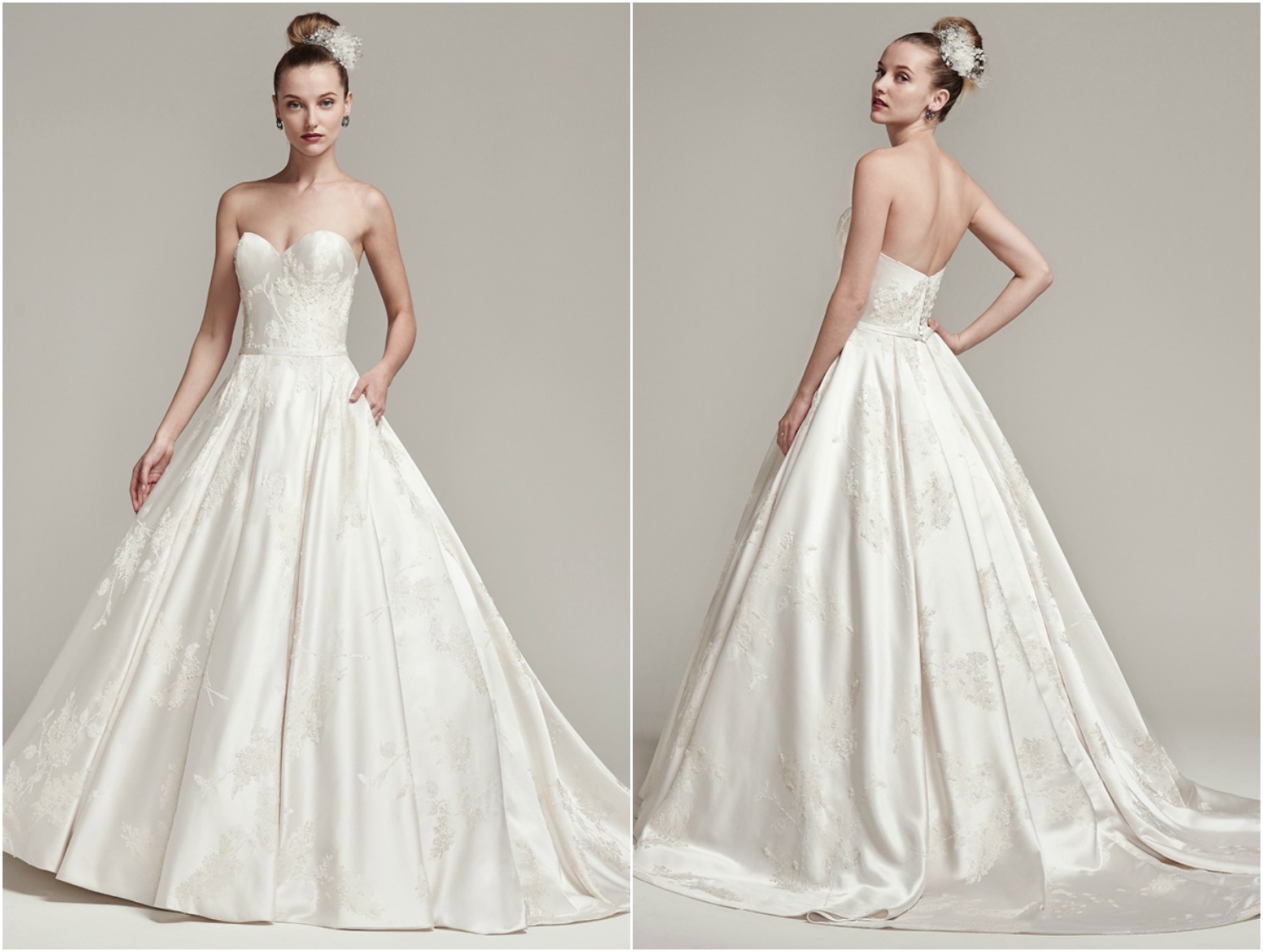 Dramatically structured, this luxurious brocade ball gown, with sweetheart neckline, pockets and natural waist, features lightly beaded details and belt. Finished with a stunning full train and covered buttons over zipper and inner elastic closure.
<a href="https://www.maggiesottero.com/sottero-and-midgley/essex/9851" target="_blank">Sottero & Midgley</a>