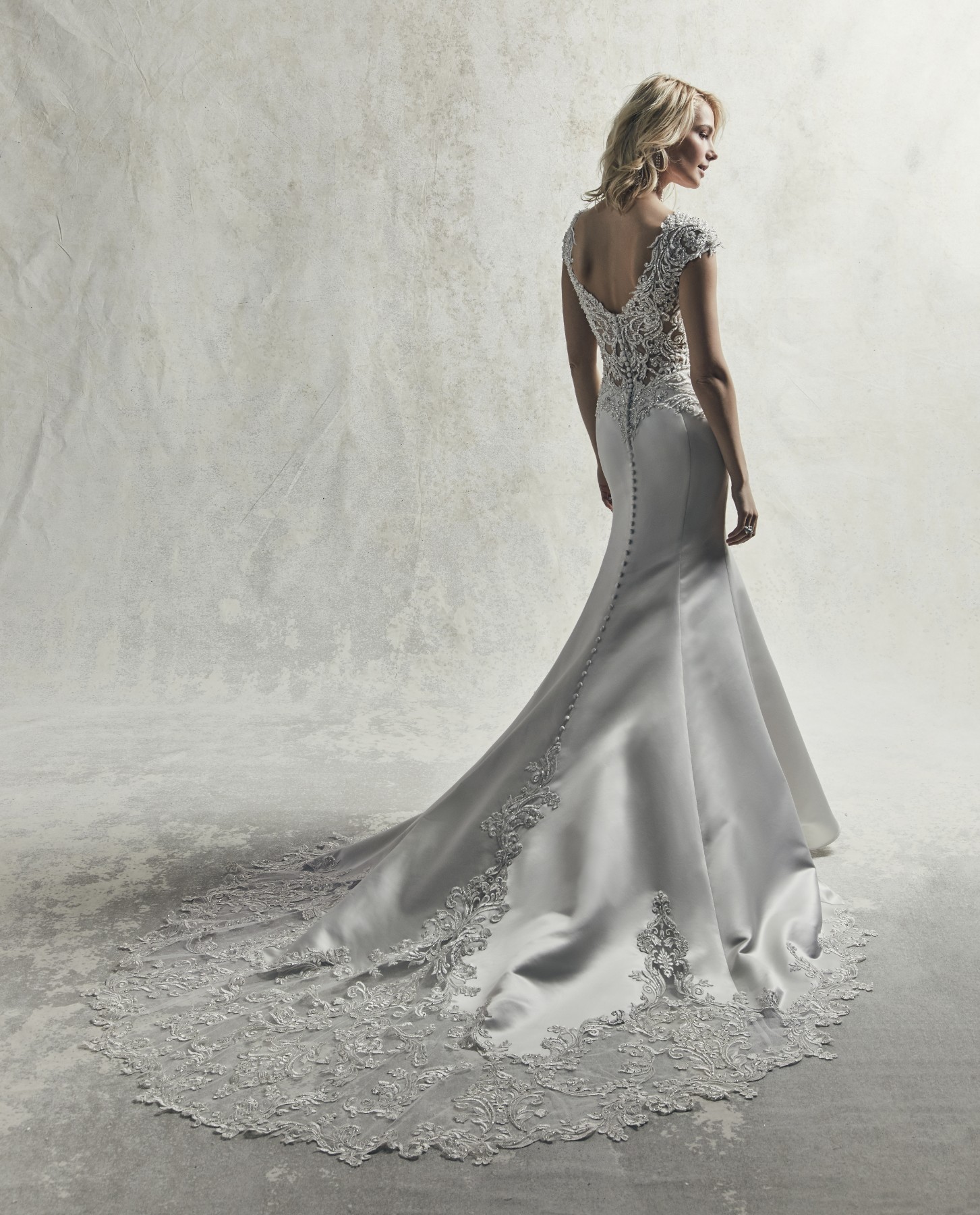 <a href="https://www.maggiesottero.com/sottero-and-midgley/gibson/11850">Gibson</a> Credits: Sottero &amp; Midgley.