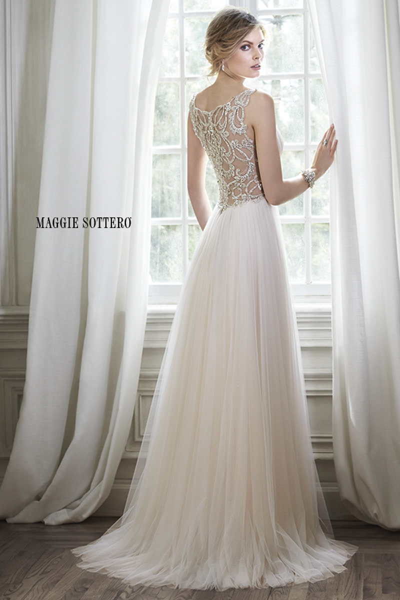 Romance is found in this stunning tulle sheath dress with plunging neckline and sparkling Swarovski crystal embellishment at the waist. Intricate patterns of beaded embroidery adorns a daring illusion back. Finished with crystal button over zipper closure.
<a href="http://www.maggiesottero.com/dress.aspx?style=5MR054&page=0&pageSize=36&keywordText=&keywordType=All" target="_blank">Maggie Sottero</a>