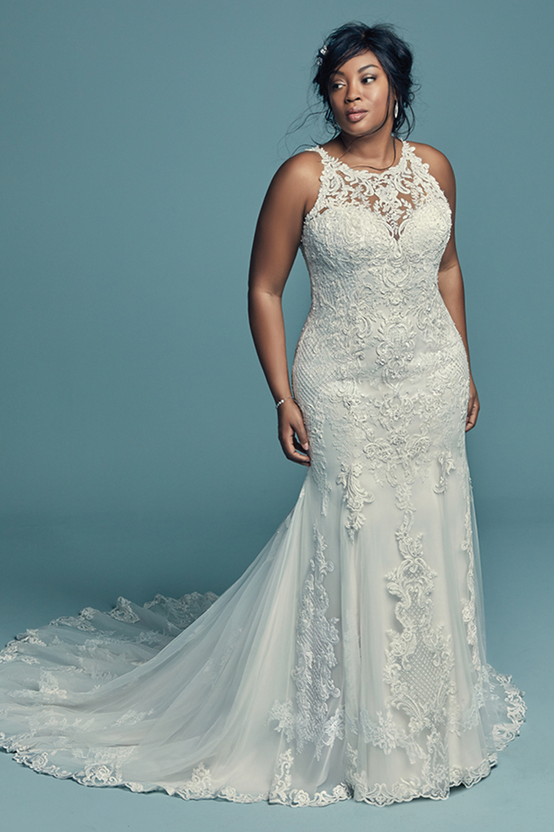 <a href="https://www.maggiesottero.com/maggie-sottero/kendall-lynette/11489">Maggie Sottero</a>
Clássico, mas de cortar a respiração: assim é este vestido de noiva fit-and-flare que apresenta pormenores rendados e cristais Swarovski ao longo do seu tule. Terminado com pormenores de renda que adornam o seu decote ilusão halter sobre um decote em forma de coração. Terminado com botões sobre um fecho.