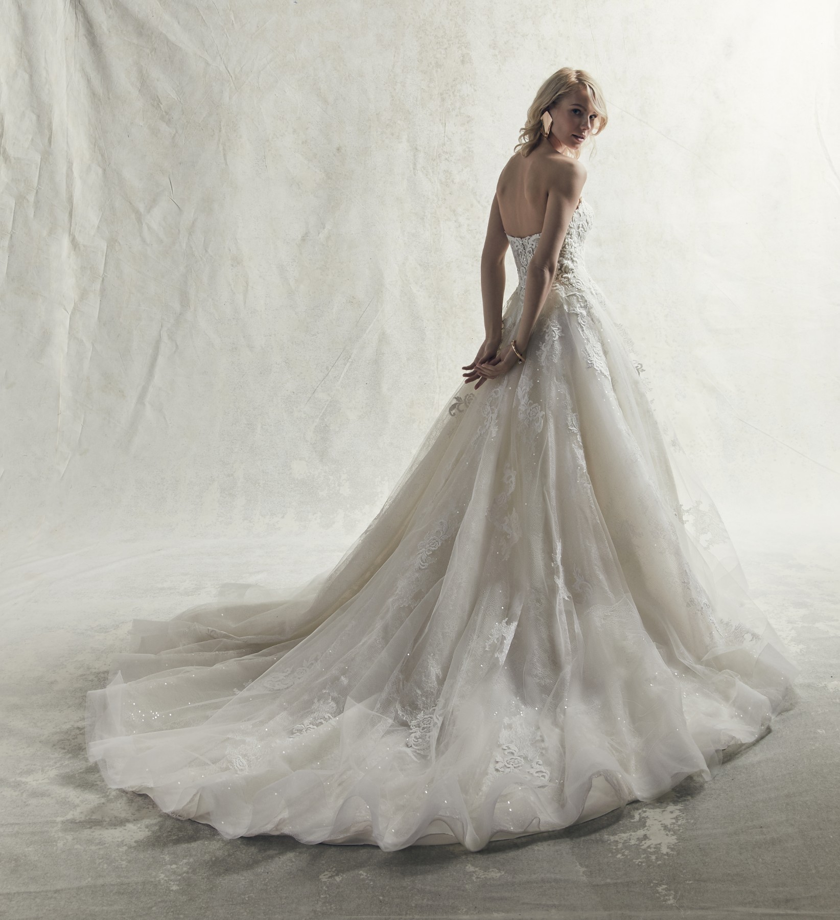 <a href="https://www.maggiesottero.com/sottero-and-midgley/tucker/11864">Tucker</a> Credits: Sottero & Midgley.