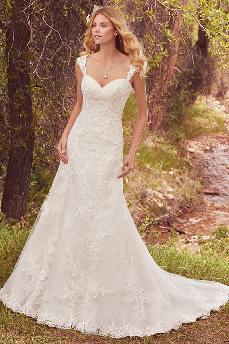 A lovely crosshatch-patterned tulle features cascades of lace appliqués in this timeless fit-and-flare, complete with strapless sweetheart neckline and scalloped lace hem. Finished with corset closure, or covered buttons over zipper and inner elastic closure. Detachable cap-sleeves with lace appliqués sold separately. 
<a href="https://www.maggiesottero.com/maggie-sottero/samantha/10141?utm_source=mywedding.com&amp;utm_campaign=spring17&amp;utm_medium=gallery" target="_blank">Maggie Sottero</a>