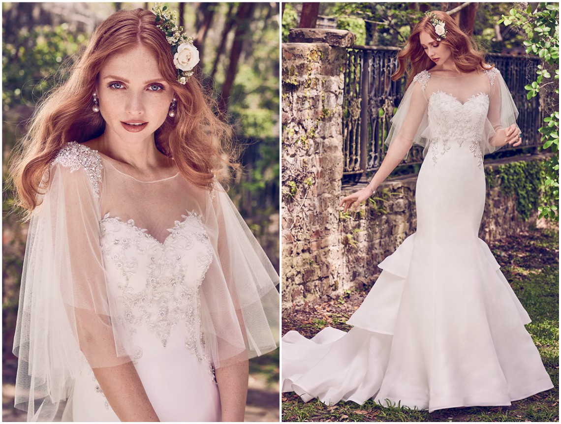 Os motivos em renda e os cristais Swarovski acentuam o corpete, com decote coração e decote ilusão nas costas neste vestido de noiva em organza, com uma saia fit-and-flare com uma saia em camadas, que termina em ligeira cauda. Acabamentos com botões de cristal sobre fecho zíper. A capa em tule transparente com pedraria e cristais Swarovski nos ombros é vendida em separado. <a href="https://www.maggiesottero.com/maggie-sottero/quintyn/11185?utm_source=zankyou&utm_medium=gowngallery" target="_blank">Maggie Sottero</a>