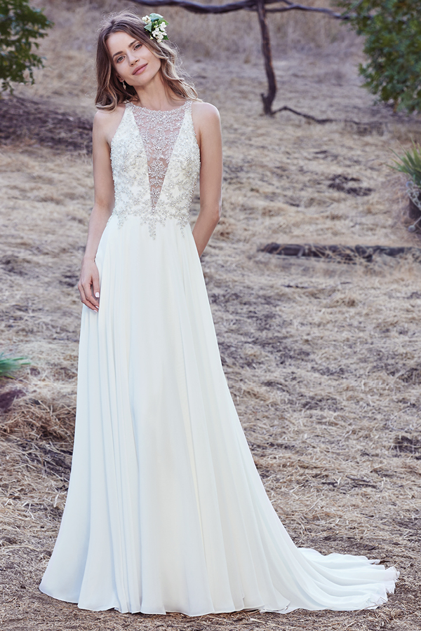 Este vestido sem mangas exibe um corpete realçado com cristais Swarovski e bordados delicados que criam um efeito de joalharia ao longo do profundo decote em V e das costas abertas com efeito ilusão. A saia Revina Chiffon oferece o romante e elegância a este look. Terminado com botões.